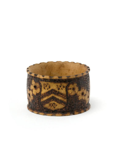 A late 19th century pokerwork 'Manners Makyth Man' napkin ring