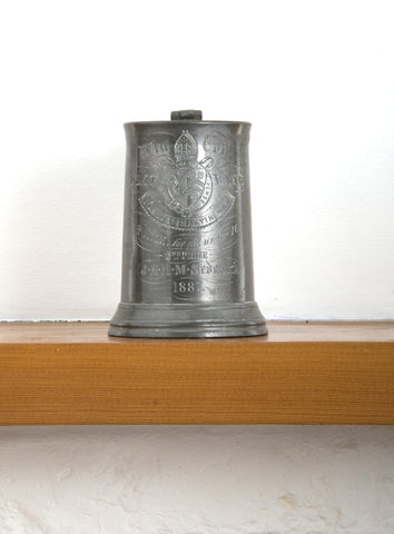 A pewter tankard awarded for the half mile under 16 flat race, 1887